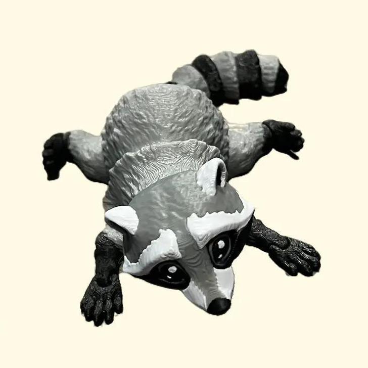 3d printed articulated raccoon figurines - Design by matmiremakes